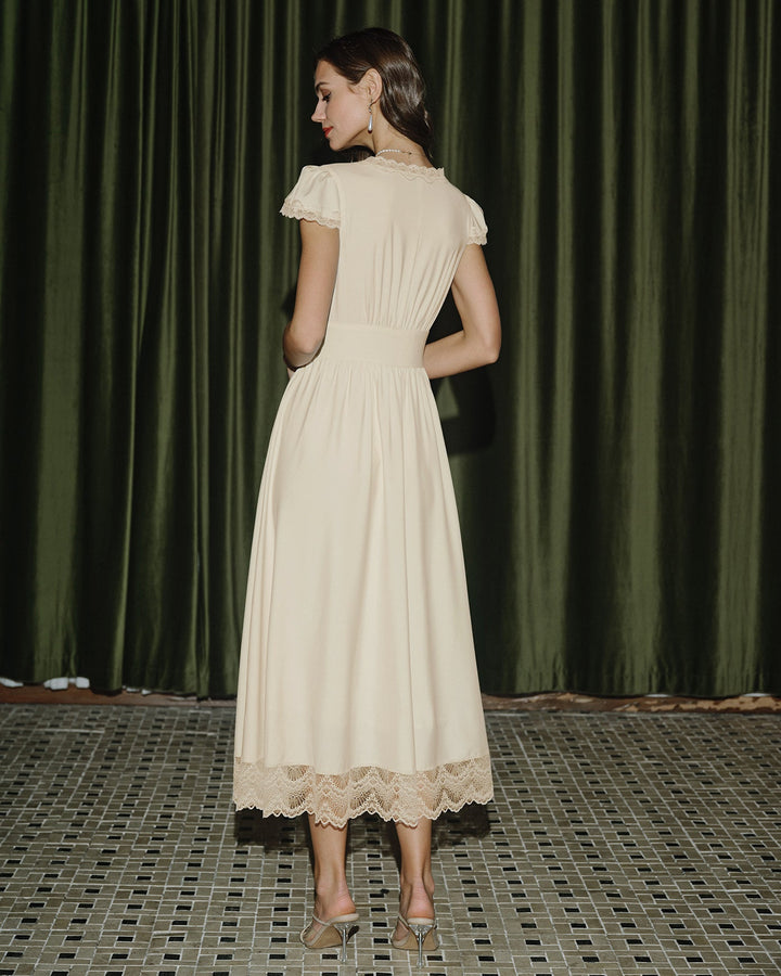 Éliane | Robe longue col V en dentelle abricot